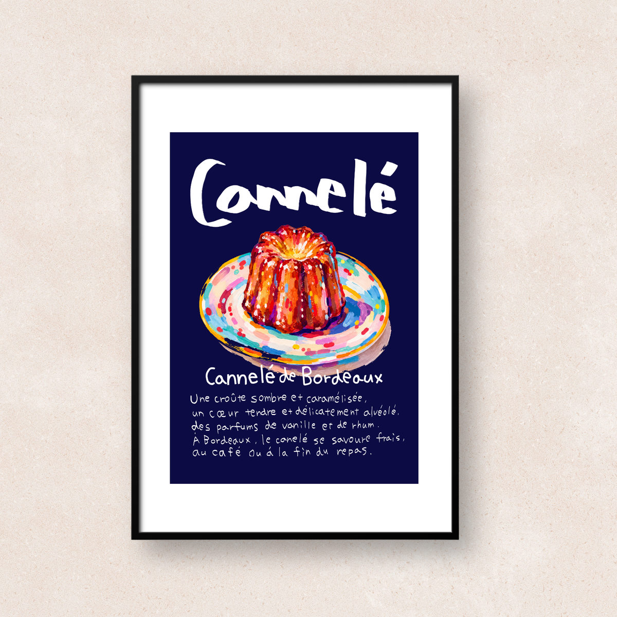 ネイビーの背景にカラフルな皿にのせたカヌレとフランス語の文字を描いたアート「Cannelé de Bordeaux」